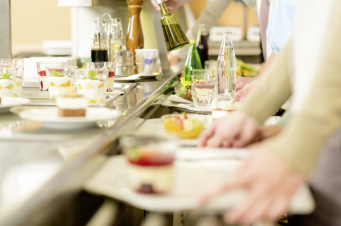 Desserts at cafeteria people with serving tray self service canteen